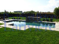 Photo d'une piscine creusée rectangle à Brossard. - Piscine et béton Larivière